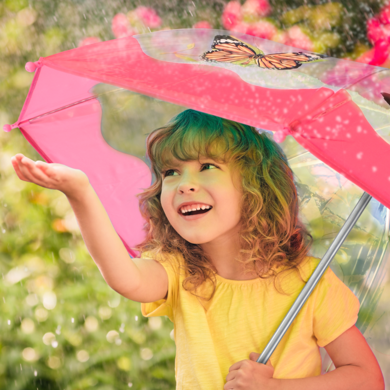Little girl holding butterfly umbrella